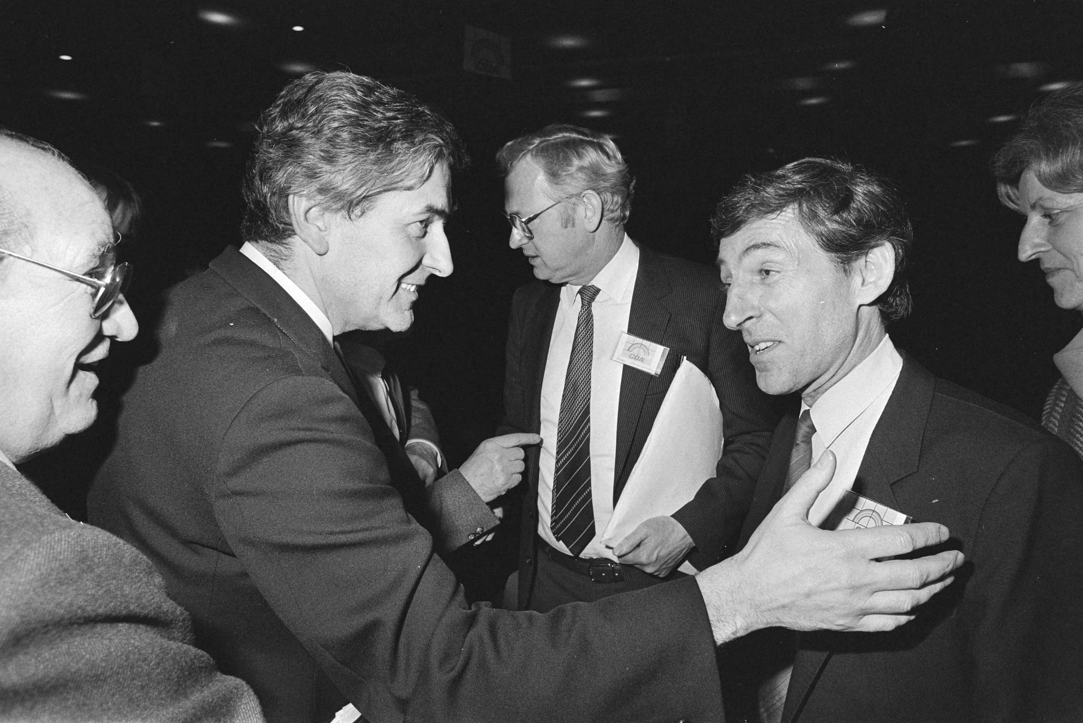 Fotocollectie Anefo — CDA-congres over Europese verkiezingen (Breda); premier Lubbers, lijsttrekker Beumer, Europese commissaris Andriessen — Foto: Bogaerts, Rob / Anefo. Licentie: Set B: Rechtenvrij / Publiek Domein. Bron: Nationaal Archief. http://hdl.handle.net/10648/ad348612-d0b4-102d-bcf8-003048976d84