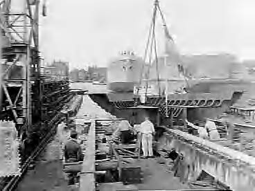 Fotocollectie Anefo — Tewaterlating vrachtschip "Spolanda" bij de Zaanlandsche Scheepsbouwmaatschappij te Zaandam. De doopplechtigheid werd verricht door mej. Danielle Smith, dochter van een van de commissarissen van rederij Spoorhout — Foto: Bilsen, Joop van / Anefo. Licentie: Set B: Rechtenvrij / Publiek Domein. Bron: Nationaal Archief. http://hdl.handle.net/10648/a97d2db2-d0b4-102d-bcf8-003048976d84