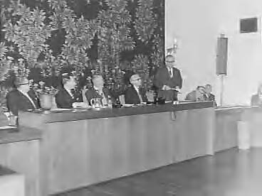 Fotocollectie Anefo — Officiele instelling Bedrijfschap voor Zeep , Wasmiddelen- en Reinigingsmiddelenindustrie in het gebouw van de SER te Den Haag. Toespraak van prof. dr. G.M. Verrijn Stuart, voorzitter van de SER — Foto: Rossem, Wim van / Anefo. Licentie: Set B: Rechtenvrij / Publiek Domein. Bron: Nationaal Archief. http://hdl.handle.net/10648/a98bdaf6-d0b4-102d-bcf8-003048976d84
